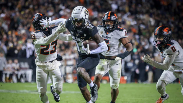 Colorado Buffaloes cornerback Travis Hunter (12) breaks past Oregon State Beavers defensive back Jermod McCoy (23) at Folsom Field